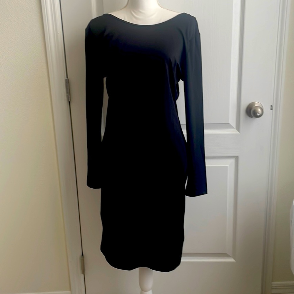 Chiquita Delgado, Black sexy long sleeve mini dress with plunging open back.